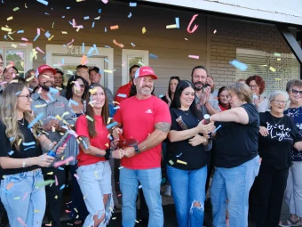 BugMan Lumberton Grand Opening Ribbon Cutting Confetti falls around Josh Culver and guests at BugMan’s ribbon cutting in Lumberton.